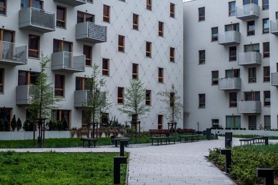 Contemporary apartment complex with landscaped courtyard and balconies