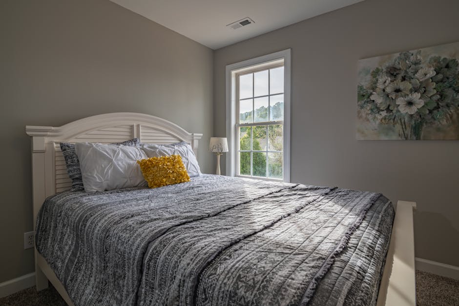 A warm, inviting bedroom with a double bed and natural light streaming in